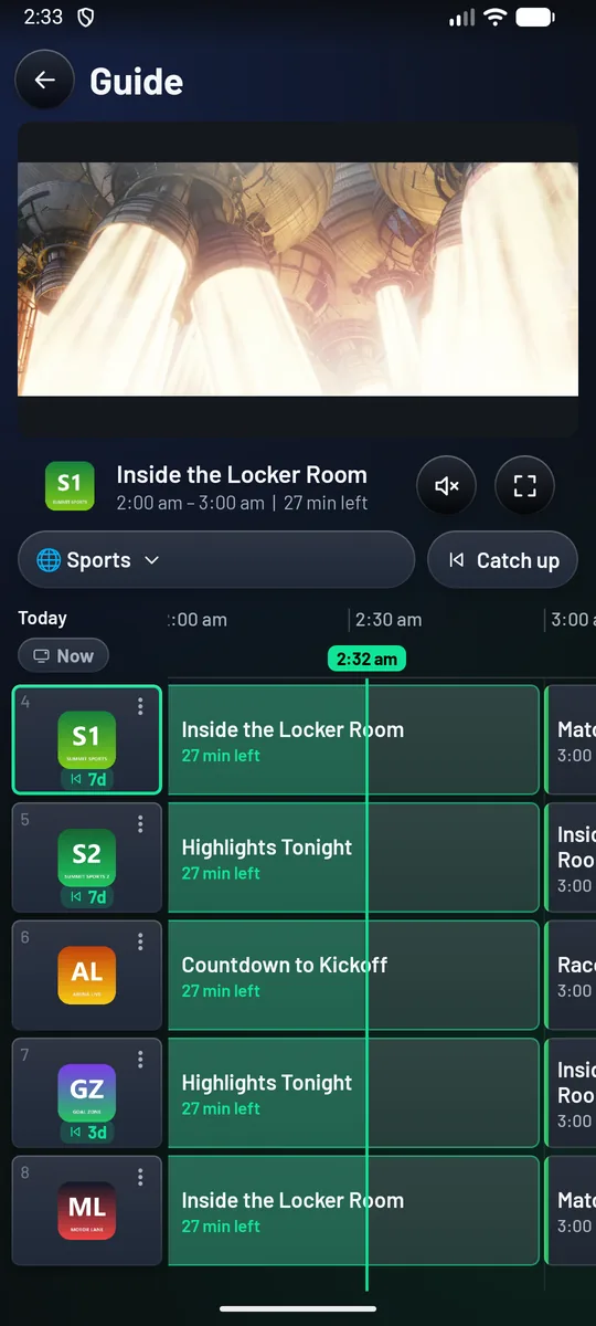The phone's guide: the channel playing at the top, and a grid of channels and programs with the current-time line.
