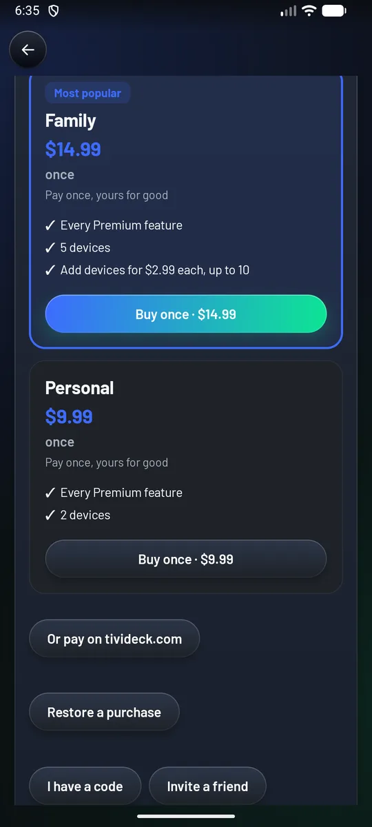 The phone's Premium page: Family, most popular, at $14.99 once on 5 devices with extra devices at $2.99 each, then Personal at $9.99 once on 2 devices, each with Buy once, and Or pay on tivideck.com, Restore a purchase, I have a code and Invite a friend.